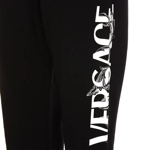 versace tecnico lucido writing all over men pants|Versace pink label pants.